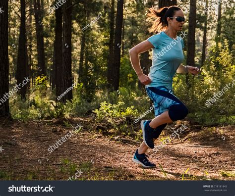 Fit Athletic Female Trail Runner Forest Stock Photo 718181845