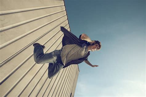 Young Man Is Falling From A Building Stock Photo Image Of Freedom