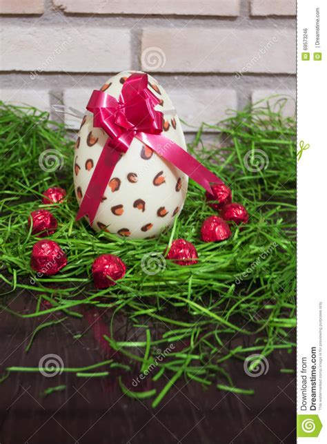 White Chocolate Easter Egg With Red Lace And Brick 4 Stock Photo