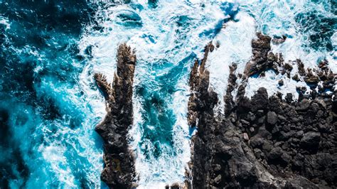 Download Wallpaper 2560x1440 Ocean Aerial View Rocks Surf Foam