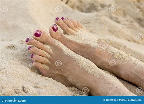 Female Feet On The Beach Covered In Sand Stock Photo Image