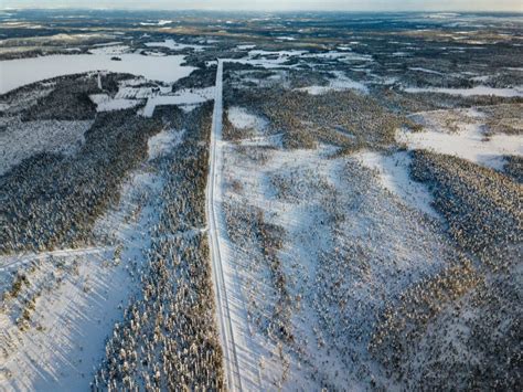 Aerial View Of Snow Winter Road And Pine Woods In Finland Stock Photo