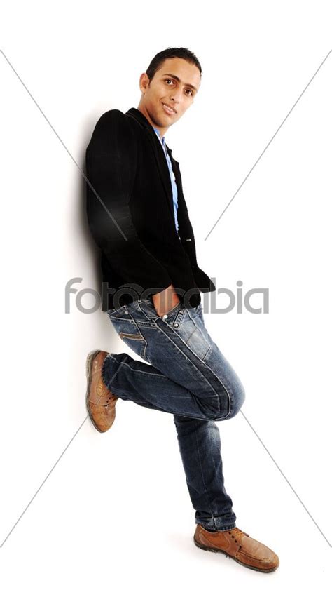 Handsome Young Man Leaning Against The Wall Stock Photo