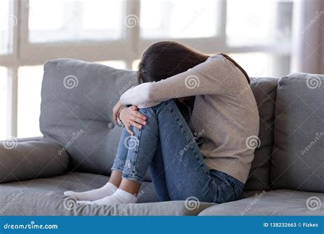 Depressed Teen Girl Sitting On Couch Feeling Anxious Ashamed Alone Stock Image Image Of