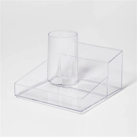 A Clear Plastic Container With A Cup On Top