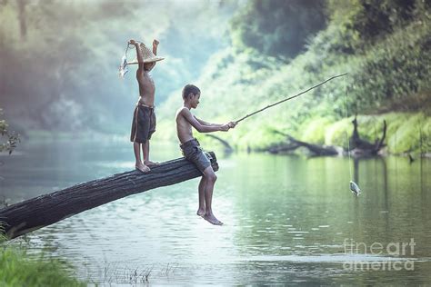 Boy Fishing At The River Photograph By Sasin Tipchai