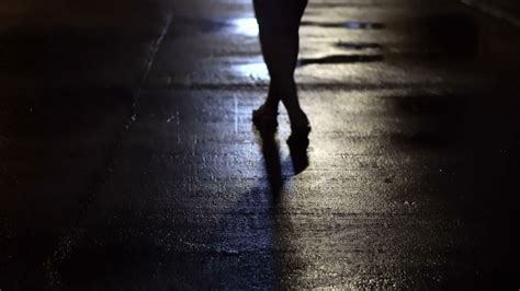 Woman Walking Alone In Dark Wet Street At Night Abstract Crime Stock