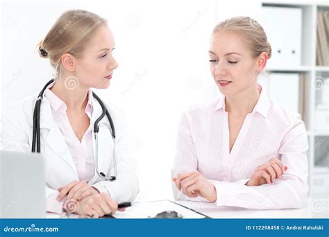 Doctor And Patient During Personal Consulting In Hospital Stock Photo