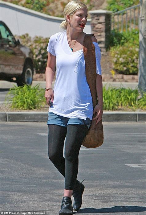 Tori Spelling Steps Out In Denim Shorts But Hides Her Pins Under A