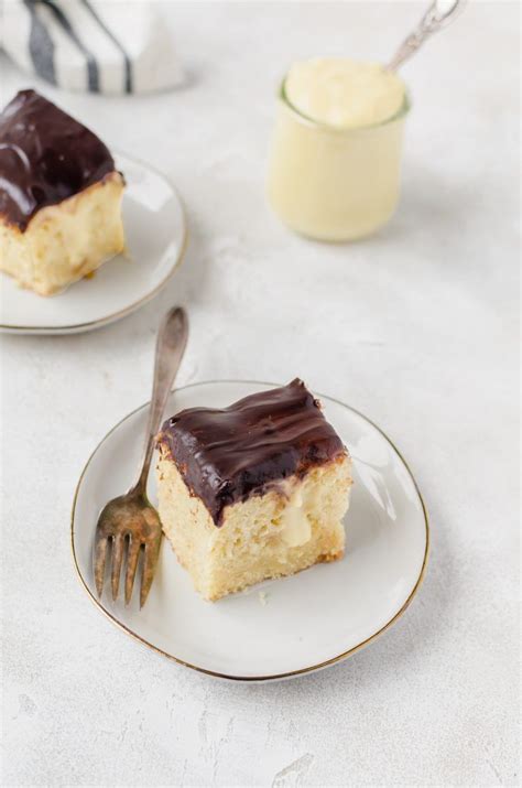 Use spoon handle to poke holes evenly across cake. Relax with some milk and this boston cream pie poke cake ...