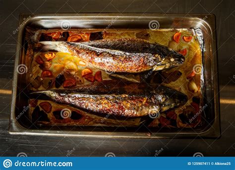 Top View On Grilled Whole Stuffed Fish With Vegetables Stock Image