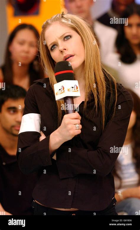 Canadian Singer Avril Lavigne Wears A Large Ring On Her Engagement Finger During Her Appearance
