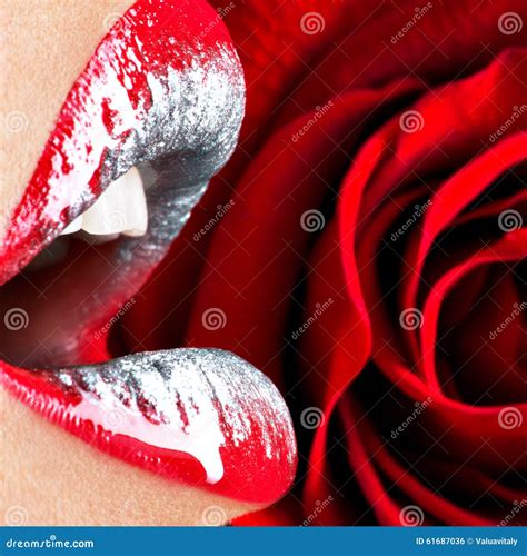 Beautiful Female Lips With Shiny Lipstick And Red Rose Stock Photo