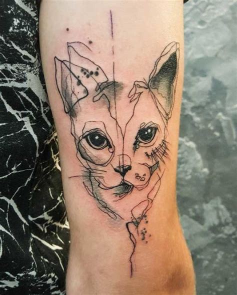 A Cat Tattoo On The Arm With An Inking Effect That Looks Like It Has