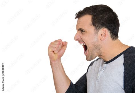 Side View Of An Angry Frustrated Man Yelling At Someone Stock Photo