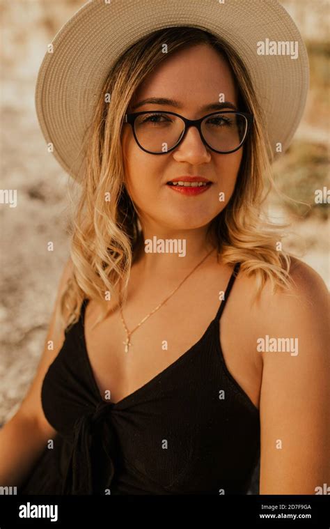 Light Skinned Woman In Glasses And A Hat Stock Photo Alamy