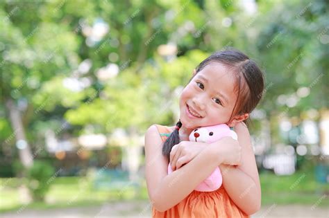 Premium Photo Portrait Of Happy Little Asian Child In Green Garden