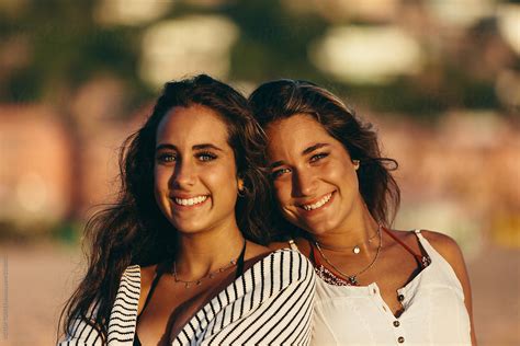 Happy Sisters At The Beach By Stocksy Contributor Victor Torres