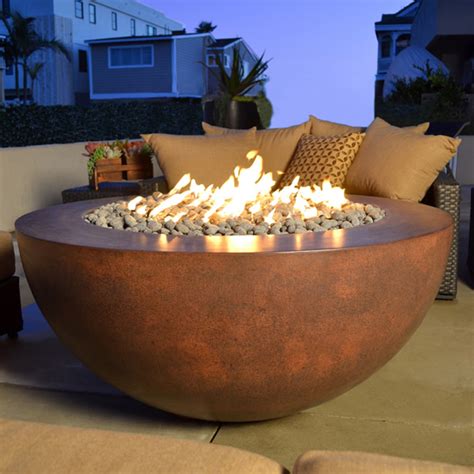 Aren't fire pits for fancy people with finished patios and intentional landscaping? Sumaco Concrete Fire Pit | Fire's Edge | Woodlanddirect.com | Outdoor Fireplaces: Fire Pits - Gas