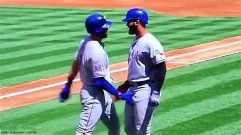 Two Baseball Players Celebrate Home Run With A Double Crotch Grab