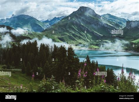 Lac De Roselend With Morning Mist Stock Photo Alamy