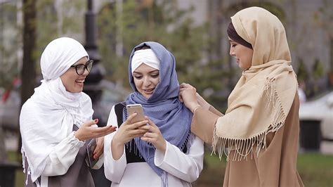 Muslim Beautiful Girl Xxx - Beautiful Muslim Girl Using Smartphone And Laughing Stock Video Footage |  My XXX Hot Girl