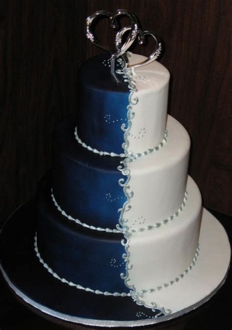 a beautiful sweet sixteen cake or quinceañera cake blue silver and white royal wedding cake