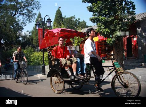 Rickshaw Drivers Take Tourists For Hutong Tour Beijing China Stock