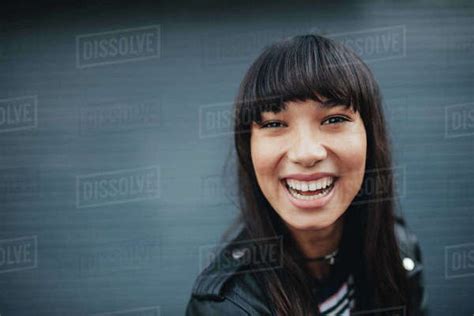Close Up Portrait Of Babe Woman Laughing Against Gray Background Beautiful Hispanic Female