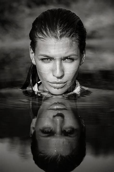 Portrait Of Woman In Water With Face Reflection Stock