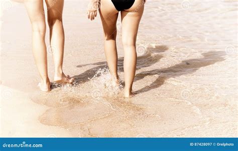 Legs Of Women Walking On The Sand At Sunset Stock Image Image Of