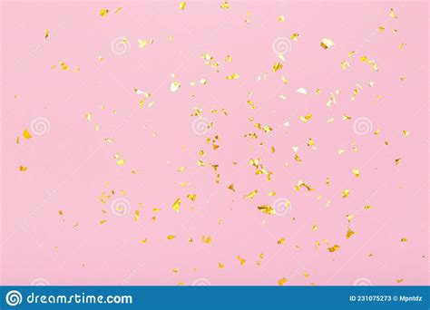 Golden Glitter Confetti Sparkles On Pastel Pink Background Flat Lay