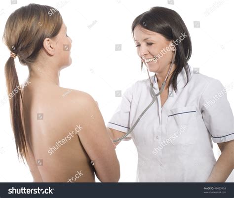 Female Doctor Performing Breast Examination Stock Photo