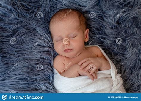Newborn Baby Boy In Bed New Born Child Sleeping Under A White Knitted