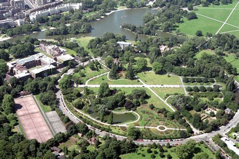 An Aerial View Of A Park With Lots Of Trees And Grass In The Middle Of It