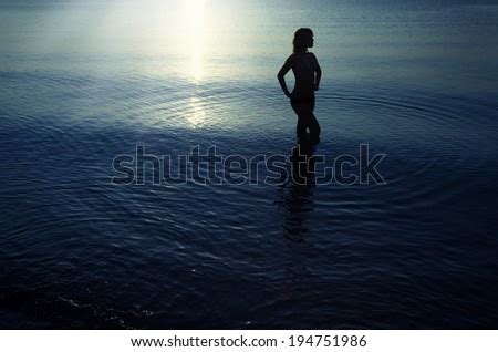 Silhouette Topless Woman Standing Water During Stock Photo