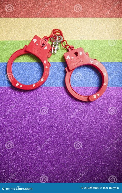 red sex toy handcuffs on glitter background stock image image of pride couple 210244003