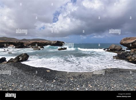 Gorgeous View Of Black Sand Stone Beach On The Carribean Island Of