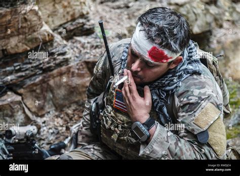 Wounded Army Ranger Machine Gunner In The Mountains Stock Photo Alamy