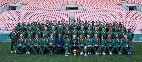 The Springbok Squad And Management Staff With The Trophies That They