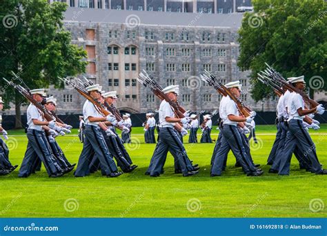 Groups Of Army Cadets In Formation Holding Rifles And Marching On The