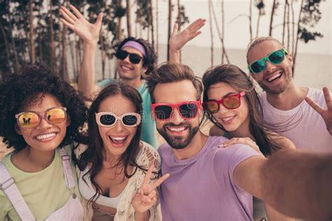 Photo Of Funky Pretty Young Six Friends Wear Casual Clothes Dark Eyewear Tacking Selfie Showing