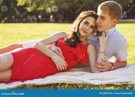 Beautiful Brunette Couple In Love Hugging On A Date In The Park Stock Image Image Of Couple