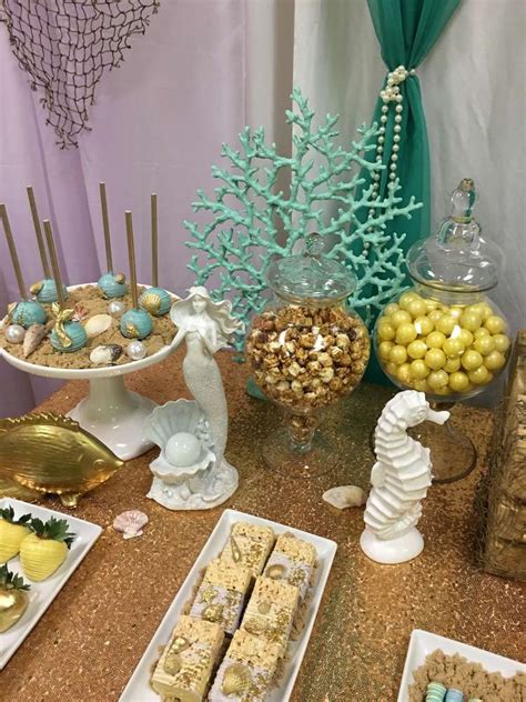 This is the perfect theme for pretty pastels and delicate florals and works equally well with subtle colors or brighter hues. Mermaid themed baby shower Baby Shower Party Ideas | Photo ...