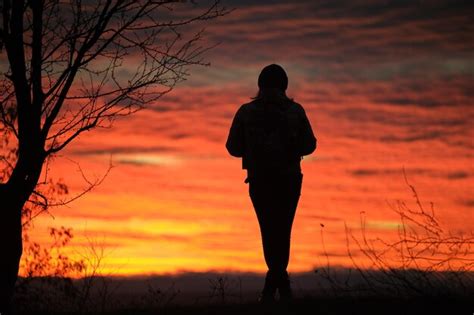 Premium Photo Dark Silhouette Of A Lonely Woman Enjoying Sunset View