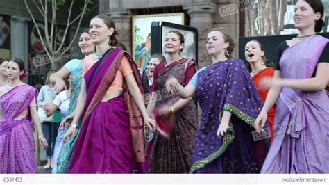 Women In Hindu Traditional Costumes Dancing And Singing Hare Krishna Mantra Stock Video Footage