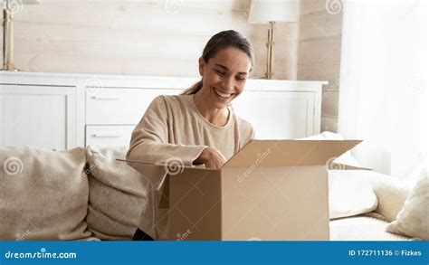 Happy Young Woman Satisfied With Internet Shopping Order Stock Photo