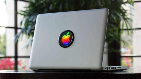 Iconic Disc Overwrites The Glowing Apple Logo Behind Your Macbook