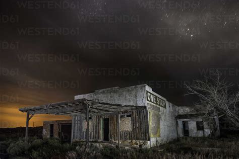Abandoned House Against Sky At Night Stock Photo