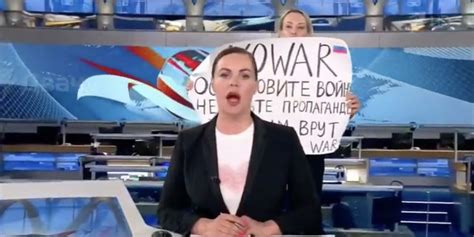 outraged editor at russian state tv interrupts her network s own broadcast shouting no war